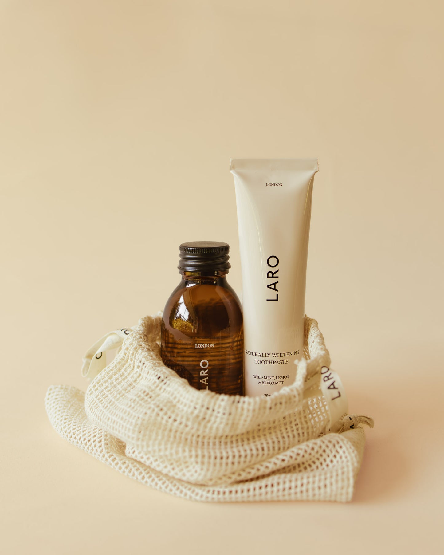 Laro Travel Edit fluoride-free Naturally Whitening Toothpaste and 100ml Travel Mouth Rinse on a neutral background