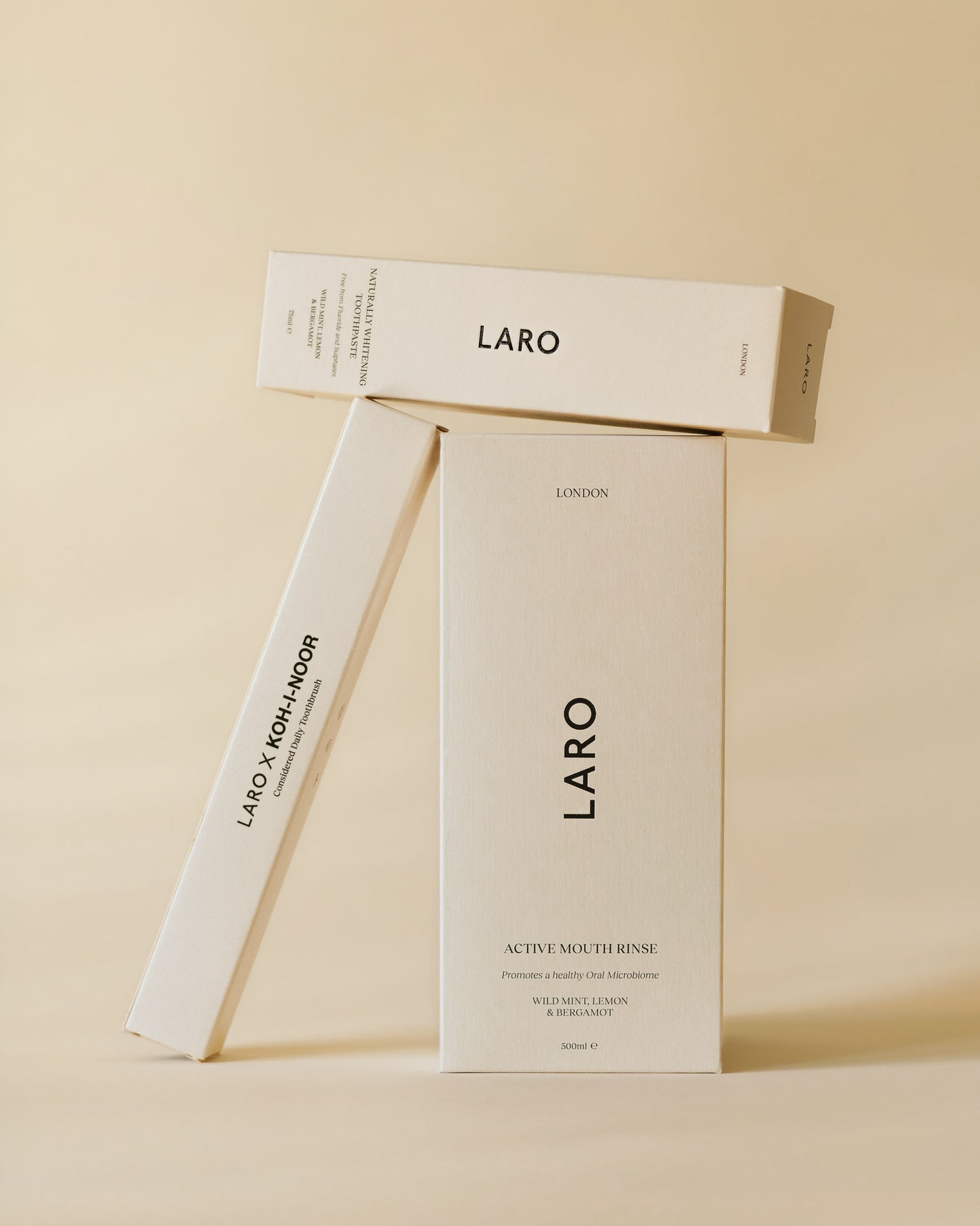 Laro signature oral care range product packaging on a beige background